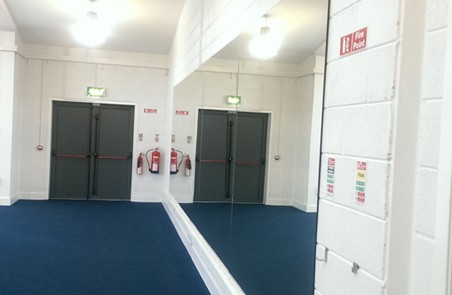 Wall of Mirrors in a cork Gymnasium